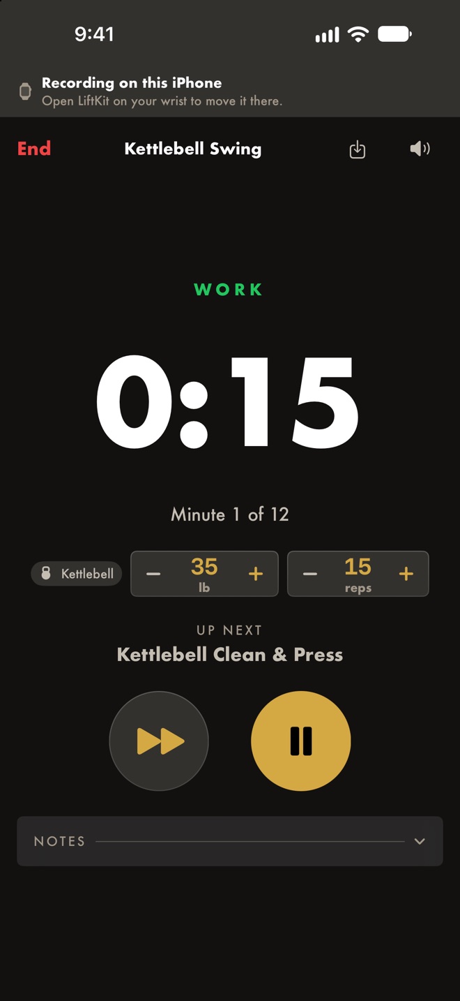 An EMOM in progress: WORK, 0:15 left, minute 1 of 12, Kettlebell Swing at 35 lb for 15 reps, up next Kettlebell Clean & Press.