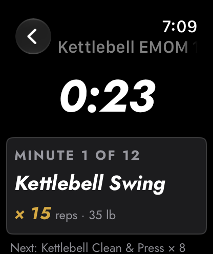 Apple Watch: a kettlebell EMOM at 0:23, minute 1 of 12, Kettlebell Swing for 15 reps at 35 lb.
